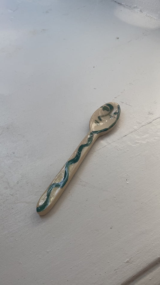 Green face spoon